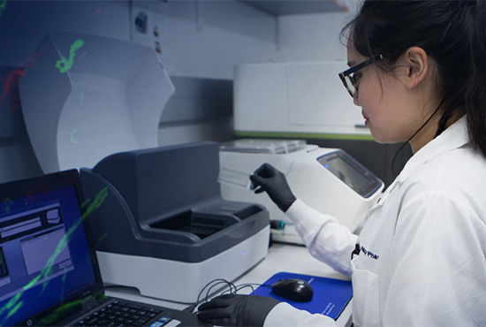 Woman using genomic equipment